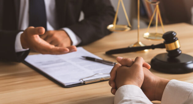 Public defender consults client, weighing private attorney option